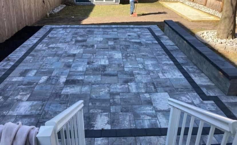 custom paver patio installation in Marlboro, NJ | gray with black edge